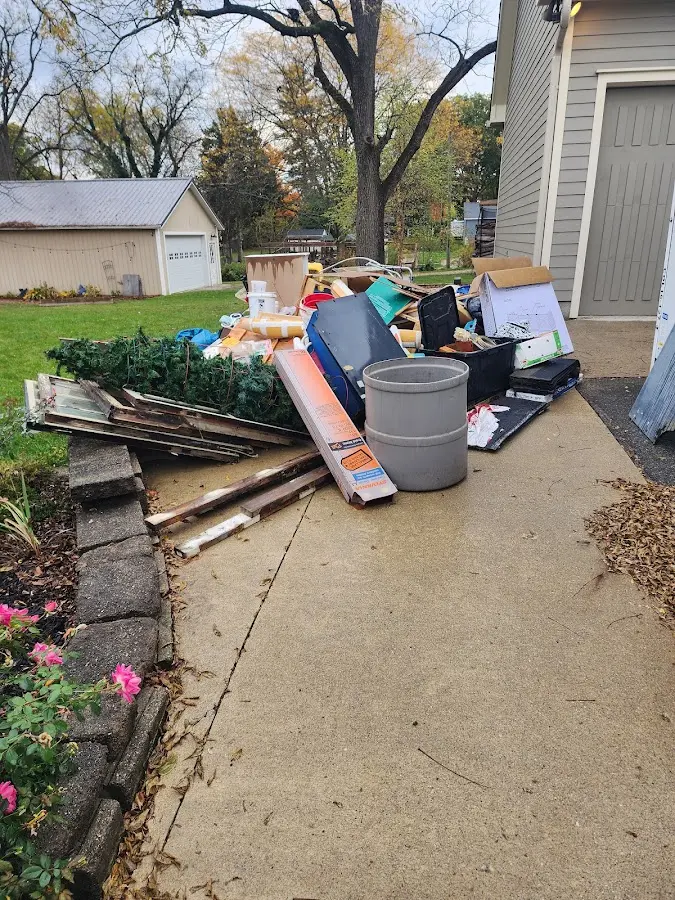 Dumpster being loaded with debris for Commercial Dumpster Rental in Chariton